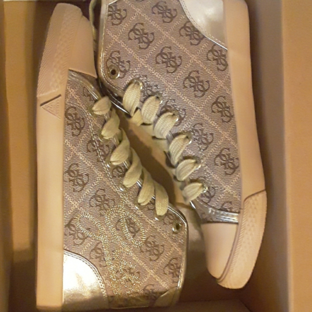 Gold high top Guess sneakers